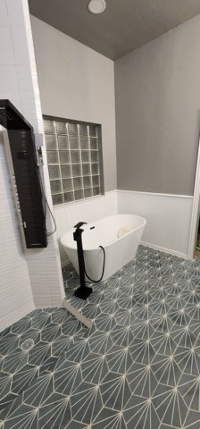 Panoramic view of completed master bathroom