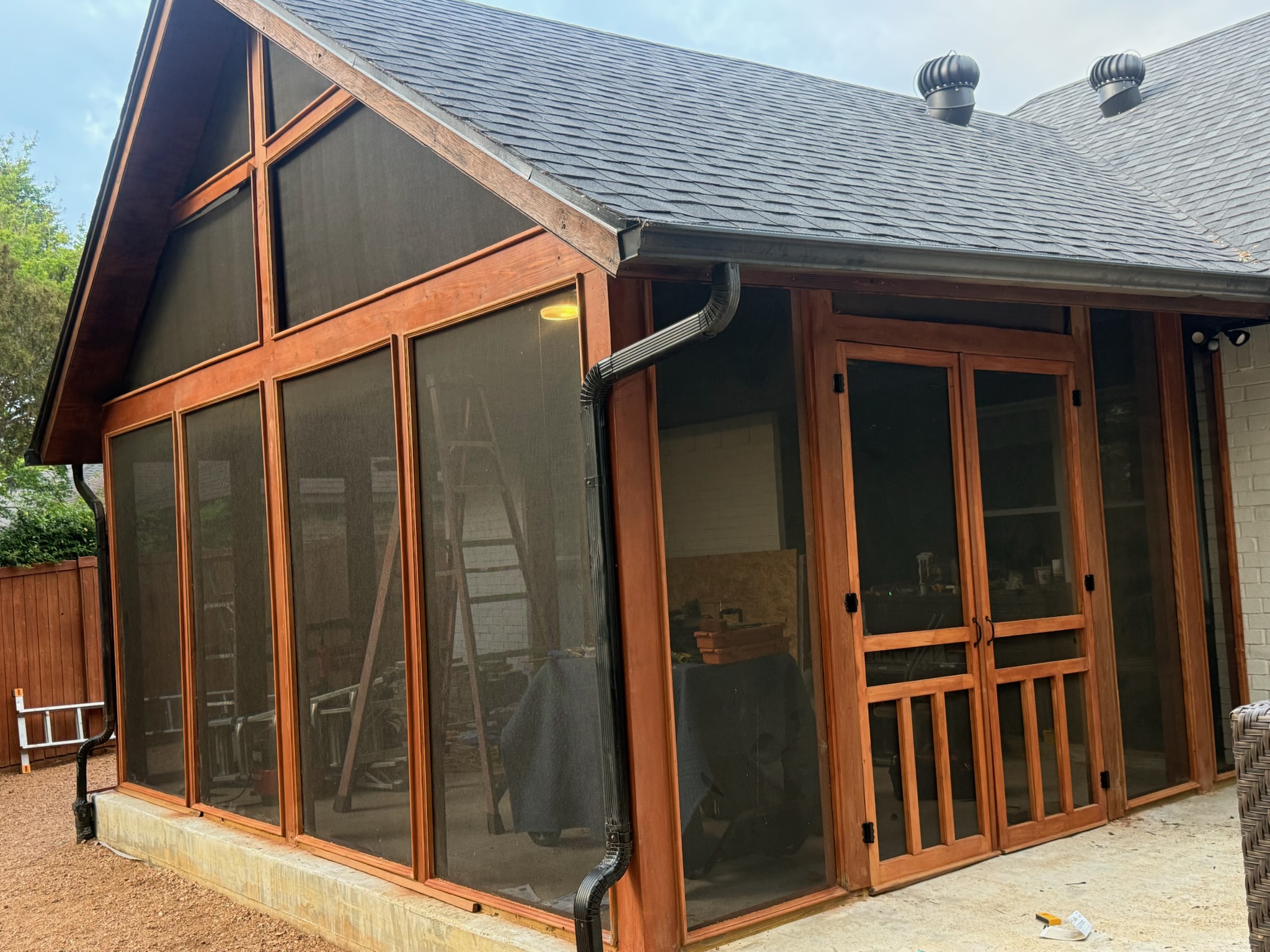 Screened porch side view with double screen door