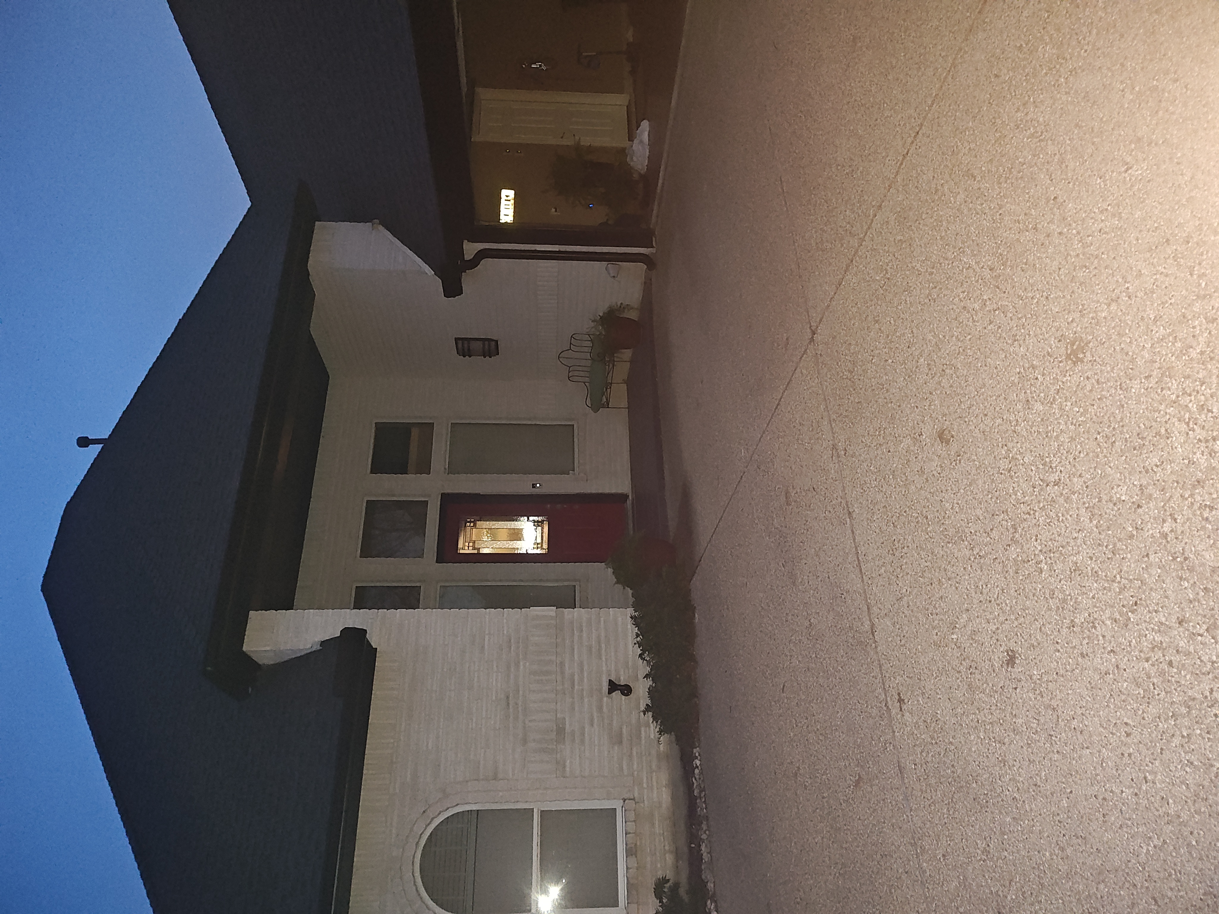 Side of home showing completed soffit and trim painting