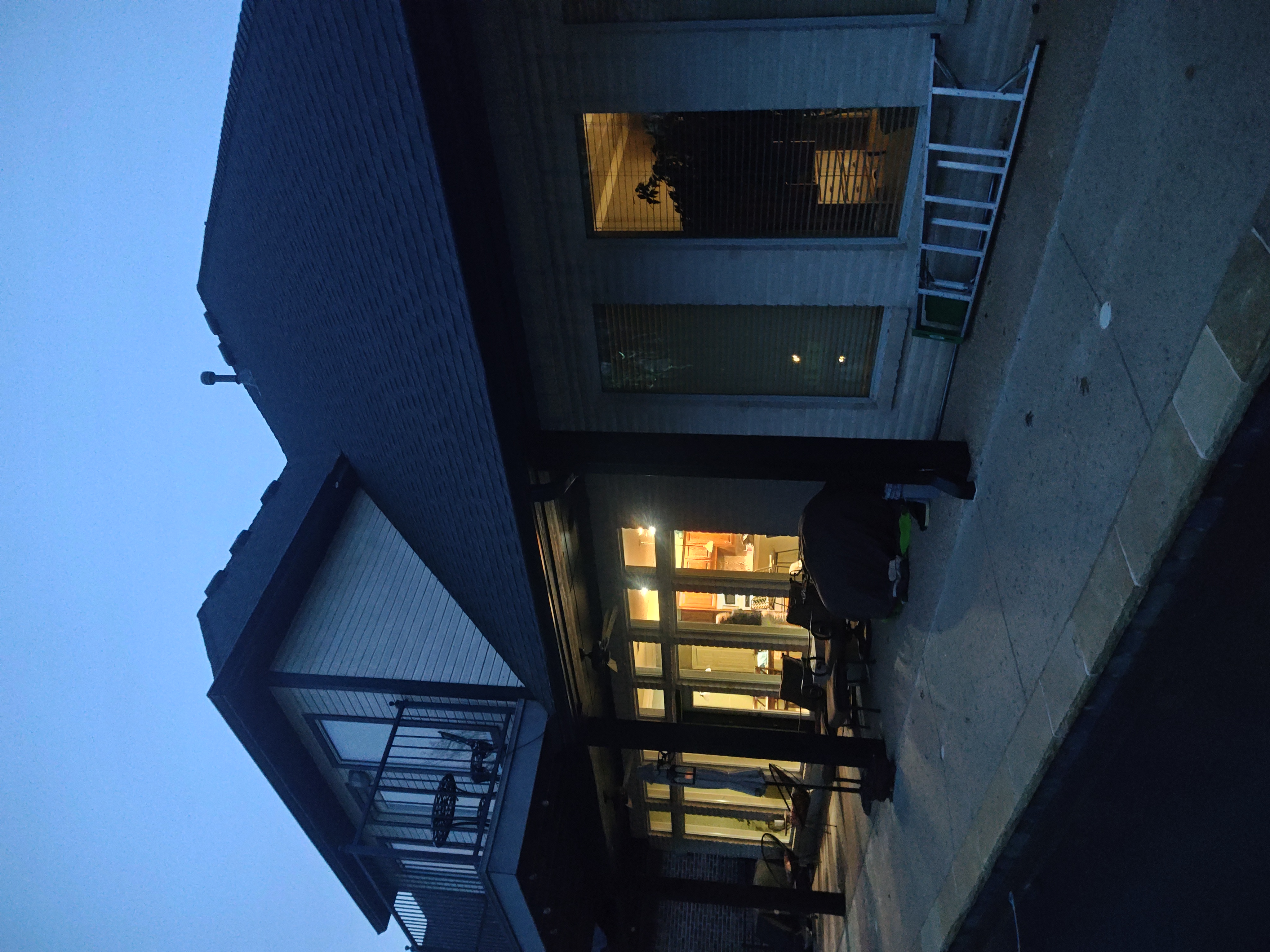 Front of home showing completed exterior trim and soffit paint