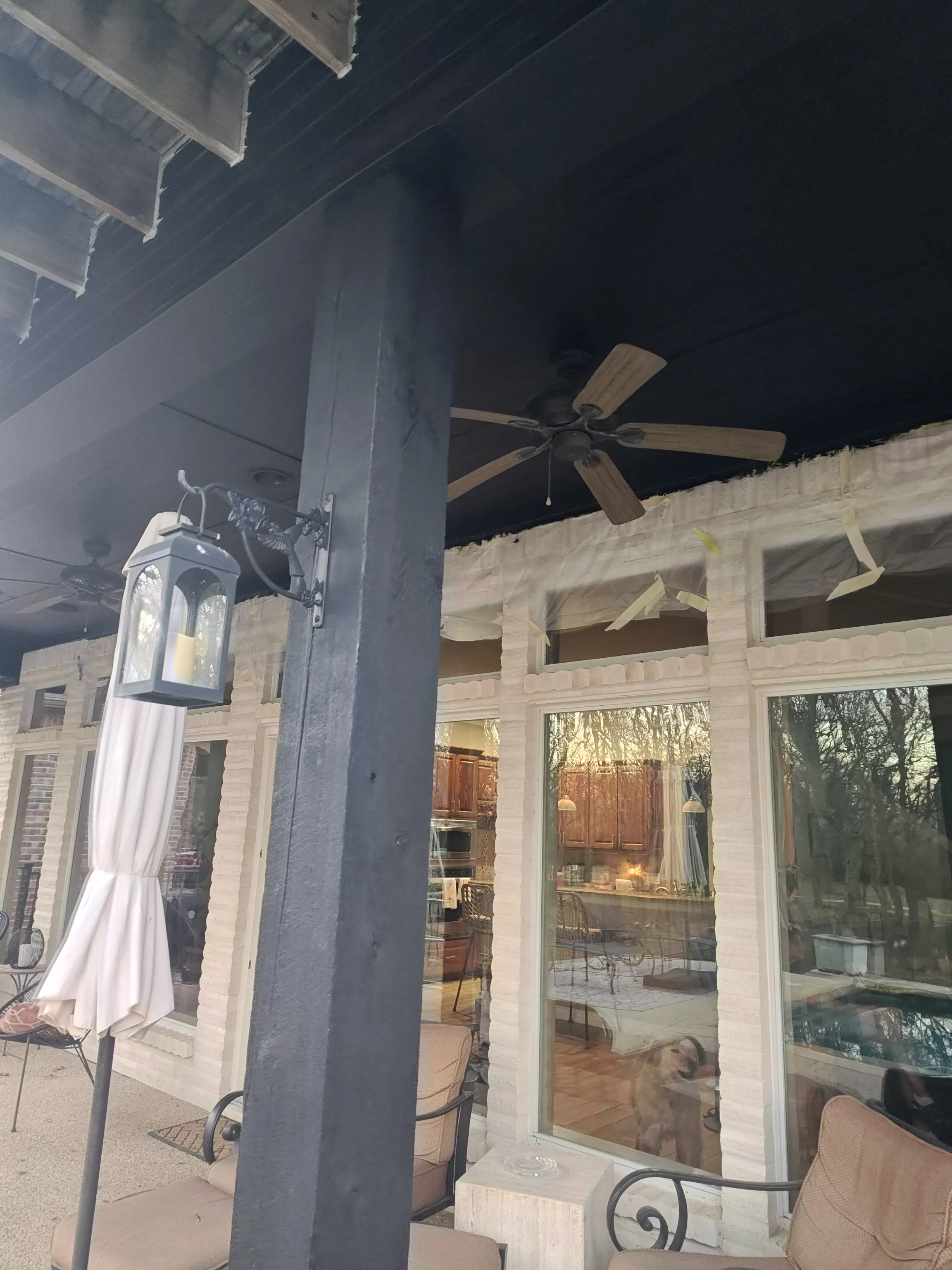 Exterior door frame masked and painted