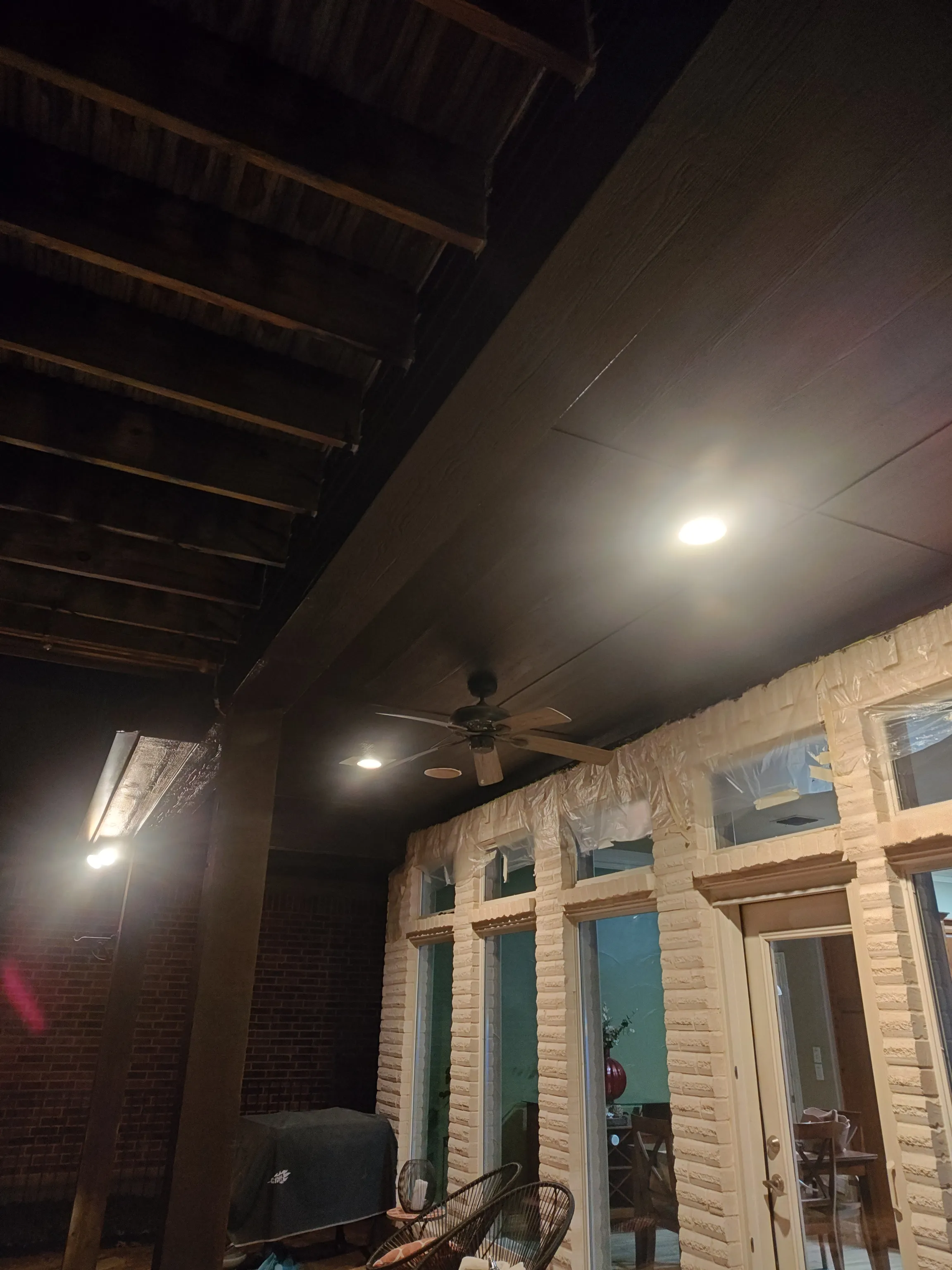 Painted black patio soffit detail with downlight